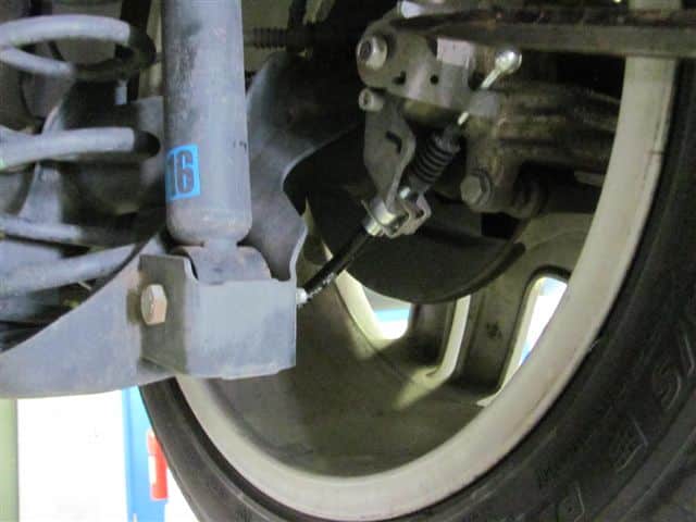 Close-up of car suspension and brake assembly