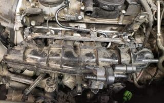 Close-up of dusty car engine intake manifold