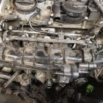 Close-up of car engine intake manifold and components
