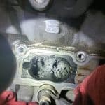 Close-up of engine intake port with carbon buildup
