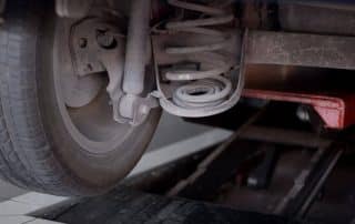 Car wheel and suspension on auto lift