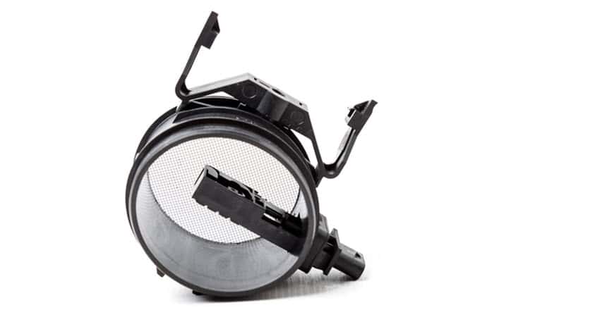 Automotive mass airflow sensor on white background