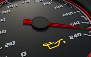 Car speedometer with oil warning light illuminated