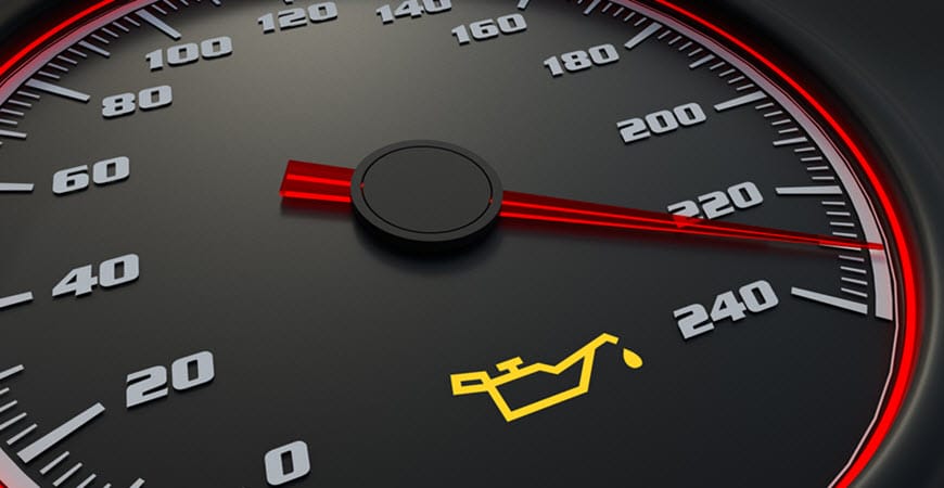 Car speedometer with oil warning light illuminated