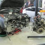 Car in garage with engine removed