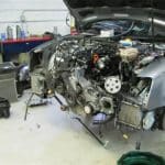 Car with front end removed in repair shop