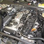 Car engine inside open vehicle hood