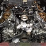 Car engine with exposed timing chains and components
