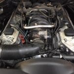 Car engine bay with visible intake manifold