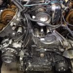 Exposed car engine with visible timing components