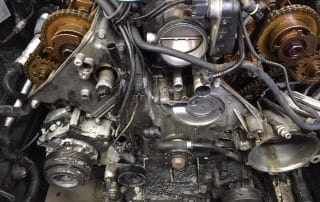 Exposed car engine with visible timing components