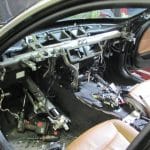 Car interior with dashboard removed and exposed wiring