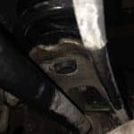 Close-up of car suspension and axle components