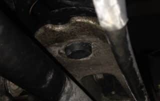 Close-up of car suspension and axle components