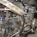 Car undercarriage with exhaust system and piping
