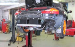 Sports car on lift in auto shop
