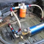 Aftermarket fuel system installed in car trunk