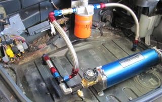 Car trunk with aftermarket fuel system components