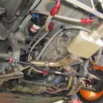 Car undercarriage with performance exhaust and suspension components