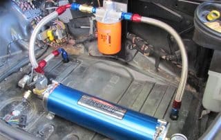Car trunk with aftermarket fuel system components