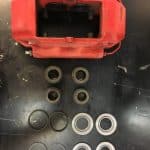 Red brake caliper with seals and components