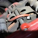 Close-up of car brake caliper and pads