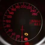 Car speedometer with warning lights illuminated