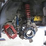Car suspension and brake assembly with wheel removed