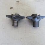 Worn and new metal mechanical parts side by side