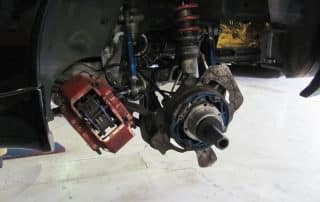 Car suspension and brake assembly with wheel removed