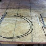 Mechanical cables and metal rods on workbench