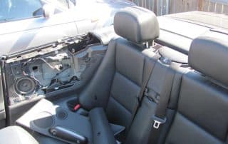 Convertible interior with removed door panel and back seats