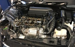 Car engine bay with exposed engine components