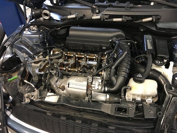 Car engine bay with exposed engine components