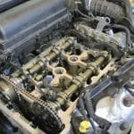Car engine with exposed camshafts and timing chain