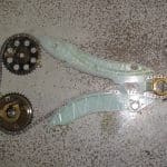Engine timing chain and sprockets on floor
