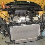 Car engine bay with front bumper removed
