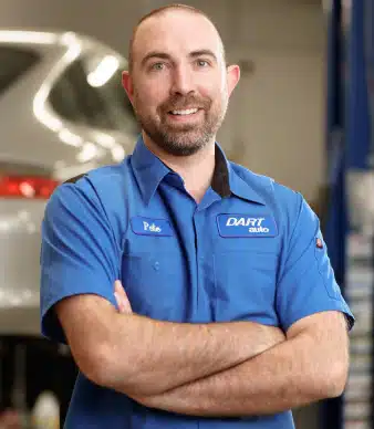 Auto mechanic standing in repair shop
