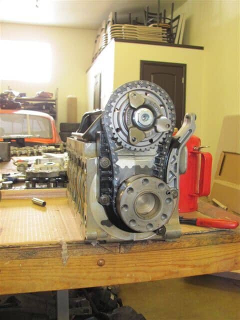 Engine block with exposed timing gears on workbench