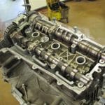 Exposed dual overhead camshaft engine cylinder head