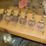 Engine pistons and connecting rods on workbench