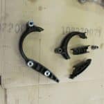 Automotive suspension components laid out on cardboard