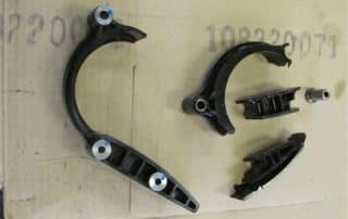 Automotive suspension components laid out on cardboard