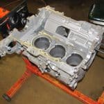 Automotive engine block mounted on stand