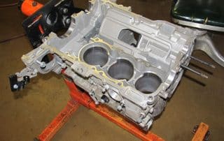Automotive engine block mounted on stand