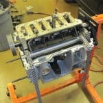 Car engine block on stand with timing chains