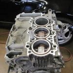 Car engine block with exposed cylinders