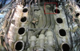 Car engine with exposed intake ports and hoses