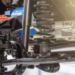 Close-up of vehicle suspension with coil spring