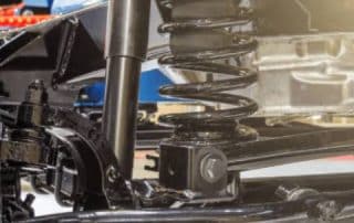 Close-up of vehicle suspension with coil spring